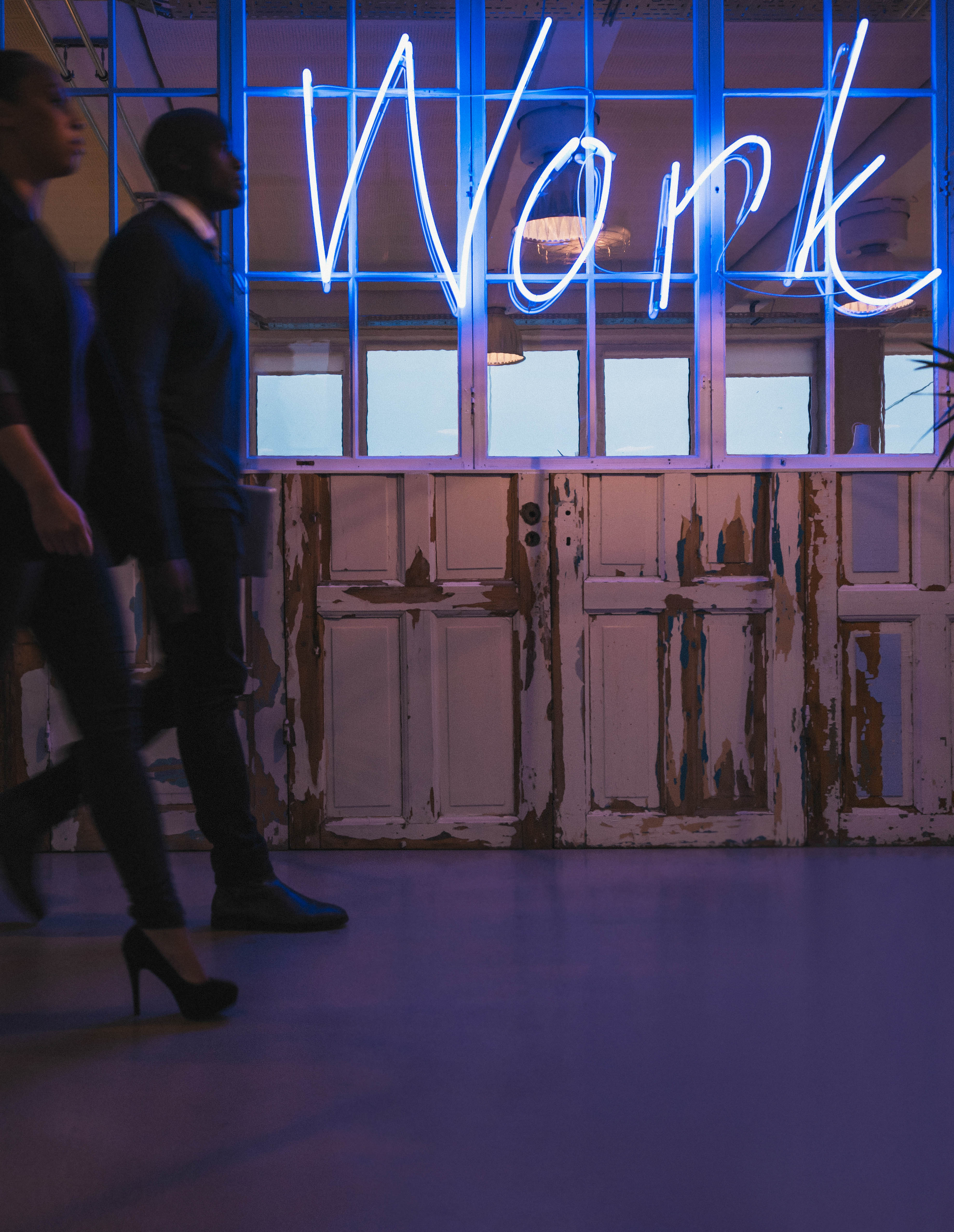 young business people walking through office corri PHXA7X9